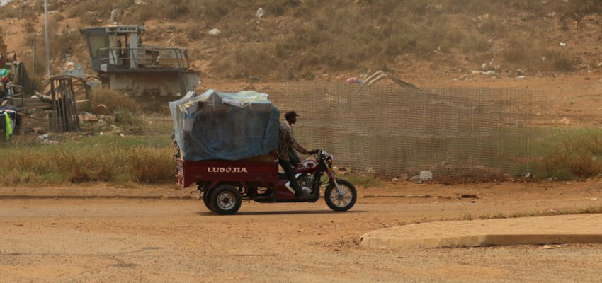 Garbage hauler transports recyclables out from the Kpone landfill