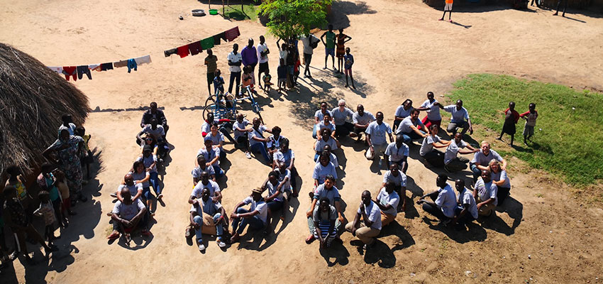 International Development Design Summit Uganda 2019 participants spell out "IDDS." Photo: Debbie Tien