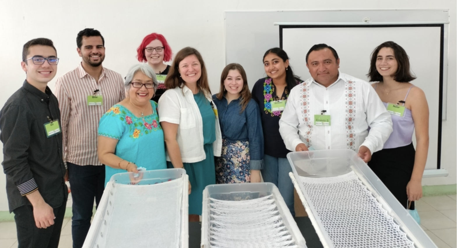 The members of the MIT D-Lab student project team (back row, left to right) Ian Rosado, Bilal Daqqah, Libby Hsu, Penelope Herrero-Marques, Shruthi Shekar, and Nour Al Maalouf, together with Perkins staff Emelia Hernandez Payan (front left) and Ernesto Santana Palma (front right) and Executive Director of Perkins International Katie Holland (front center), display the sequence of prototypes they designed to create a low-cost bathtub for children with disabilities. Photo: Courtesy of the Perkins Schoo