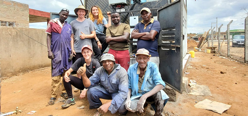 A team from MIT D-Lab and Kenyan community partner Solar Freeze celebrate the completion of the first solar-powered iteration of the forced-air evaporative cooling chamber. Using one-quarter of the energy of refrigerated cold rooms and at half the cost to build, the cooling chamber helps smallhold farmers in arid regions preserve and store freshly harvested produce. Credits: Photo courtesy of MIT D-Lab. 