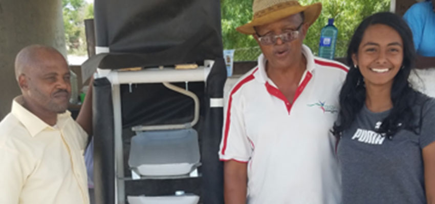 D-Lab Student Bhattacharjee along with community members showing the final Hydroponic Fodder Prototype