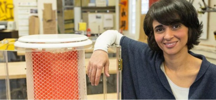 Diana Yusef in the D-Lab shot with a prototype of the ChangeWater Labs waterless toilet.