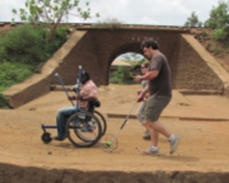 Amos Winter, right, spent three weeks in January testing the Leveraged Freedom Chair in East Africa.  Photo: Joseph Kisyoky