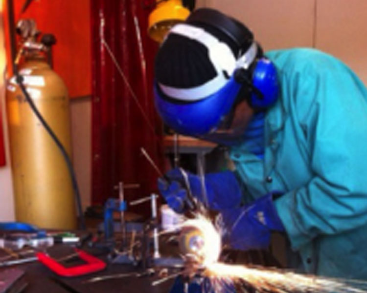 Netia welding in the D-Lab shop.  ​