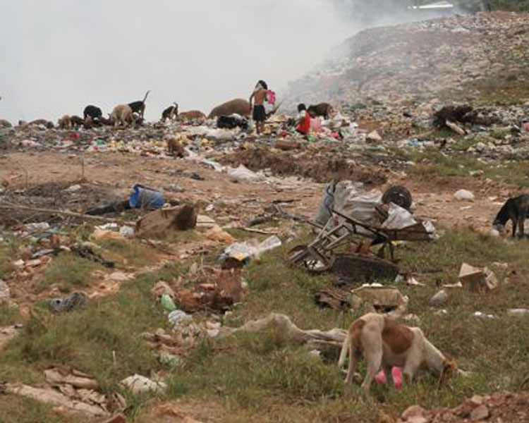 Visiting the ever-burning town dump and seeing the kids who spend their time there hunting for salvagable goods, barefoot, (hopefully) dodging the syringes and many other dangers 